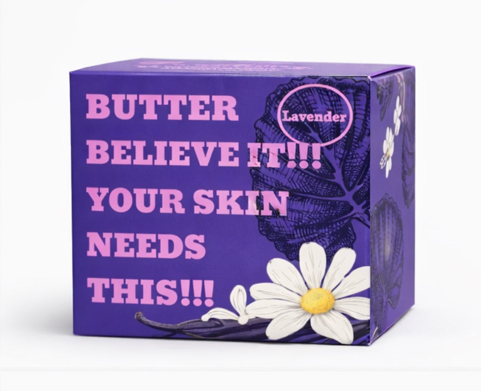 Purple Saint Nino’s Botanicals packaging box with bold text reading “Butter Believe It!!! Your Skin Needs This!!!” and floral illustrations.