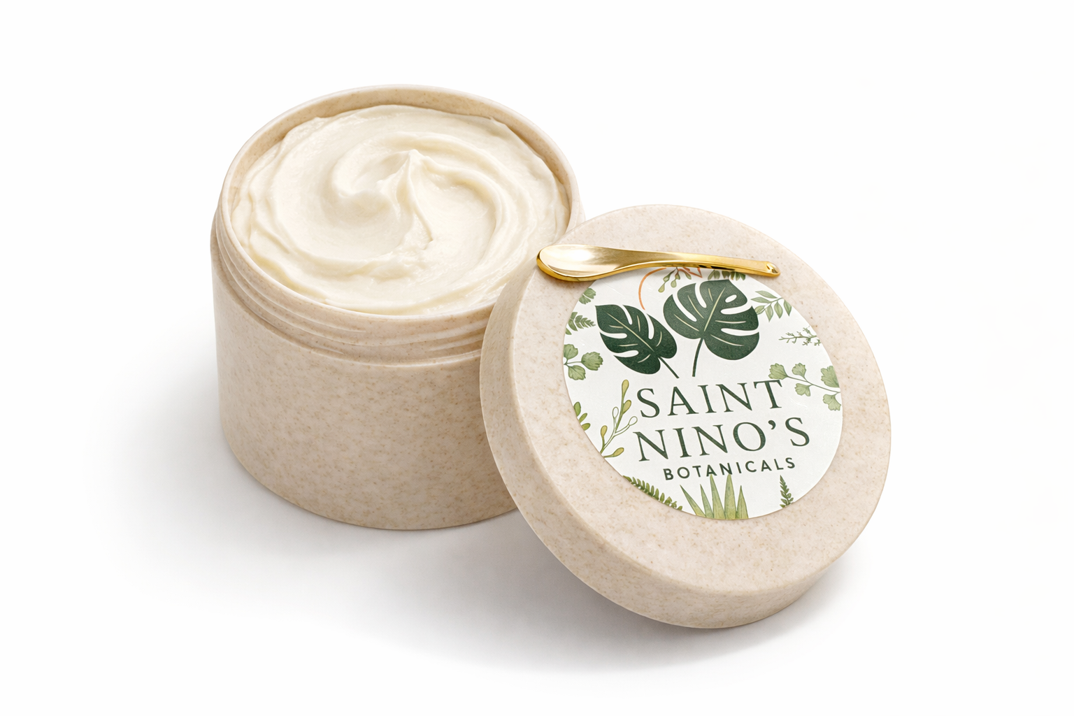 Saint Nino’s Botanicals body butter in a beige jar with lid placed beside it, showing smooth whipped butter inside.