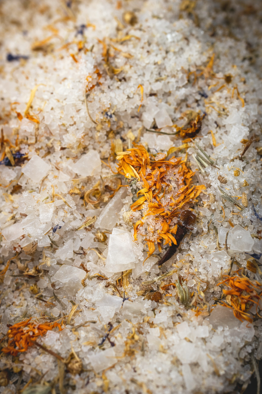 Close-up of white epsom salt with orange florals 